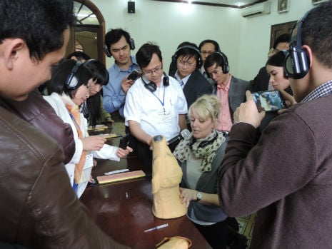 lecturers watch a practical lesson during the workshop