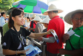 Front-line Animals Asia staff leaflet visitors